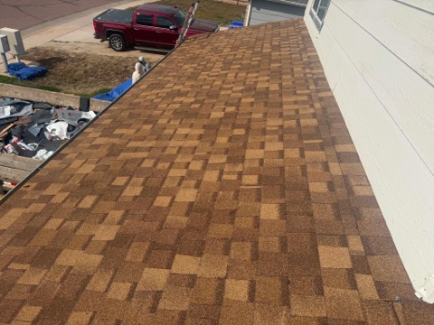 Straight shingle courses on a completed roof section